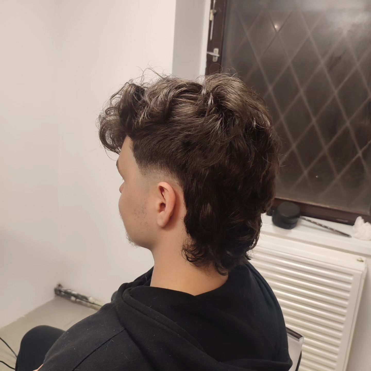 Modern haircut photographed inside Good Blend